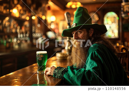 A bearded Leprechaun with green hat and green dress at a bar sits with a glass of green beer. The vintage pub exudes a warm, nostalgic vibe with wooden furniture celebrating St. Patrick's Day. A bearded Leprechaun with green hat and green dress at a bar sits with a glass of green beer. The vintage pub exudes a warm, nostalgic vibe with wooden furniture celebrating St. Patrick's Day. 110148556