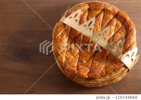 Epiphany cake on wooden table. Galette des rois traditional Epiphany cake in France 110148660