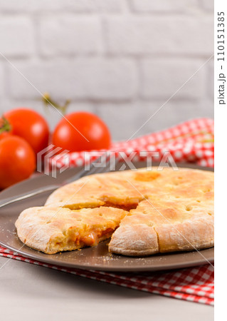 Pizza calzone on wooden background 110151385