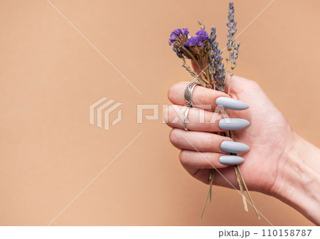 Close-up of a woman's hands with grey manicured nails 110158787