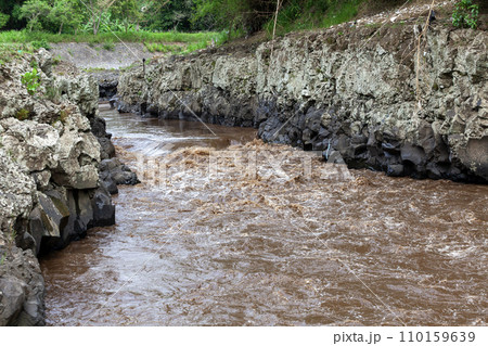 Rocks and water in the river in the rainy season. Nature background 110159639