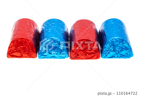 chocolate candies in foil isolated chocolate candies in foil isolated 110164722