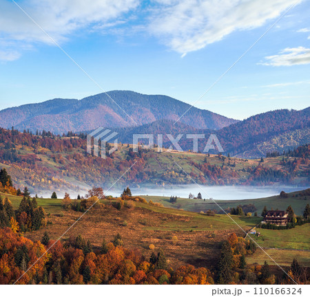 Morning foggy clouds in autumn mountain countryside.  Ukraine, Carpathian Mountains, Transcarpathia. 110166324