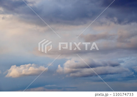 A sky filled with heavy grey clouds, suggesting impending rain or a storm. A sky filled with heavy grey clouds, suggesting impending rain or a storm. 110174733