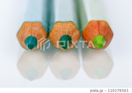 green pencil on white background 110176561