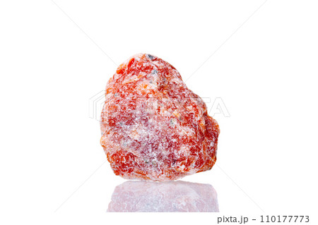 macro mineral stone orange calcite on a white background 110177773