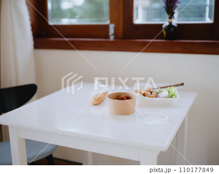 Food from delivery on the table in plastic utensils, a fast food concept Food from delivery on the table in plastic utensils, a fast food concept 110177849