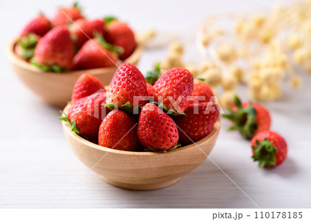 Fresh strawberry fruit in wooden bowl on white background 110178185