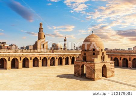 Minaret and ablution fountain of the Ibn Tulun Mosque, colourful view of old Cairo, Egypt 110179083