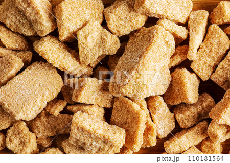 Background of brown unrefined sugar. Healthy food concept Background of brown unrefined sugar. Healthy food concept 110181564