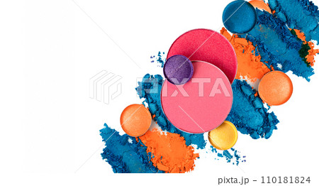 Shimmering bright palette of Face Cosmetics Make up. Cracked texture of eye shadows against white background with copy space  110181824
