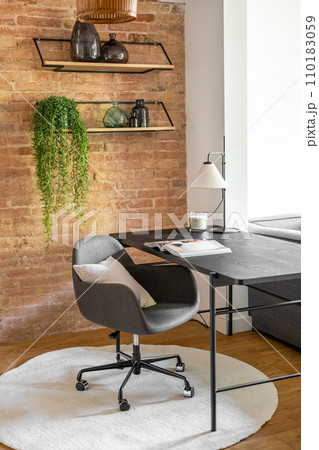Design furniture bright work area at brick wall and pot-plant 110183059