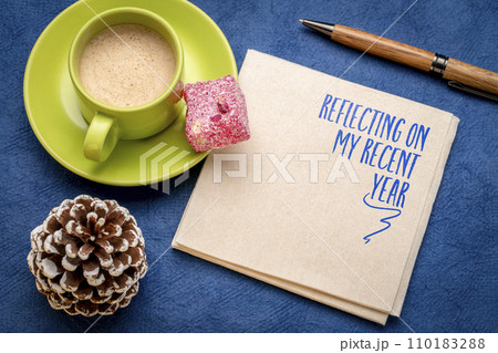 Reflecting on my recent year - a note on a napkin with coffee, end of year personal exepeince and story review 110183288