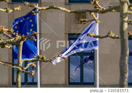 EU and Israeli flags flutter in the wind 110183571