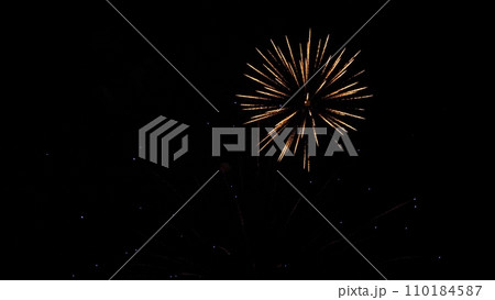 Breathtaking firework bursts color sky with abstract vivid patterns on holiday Breathtaking firework bursts color sky with abstract vivid patterns on holiday 110184587