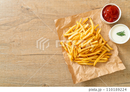 French fries with sour cream and ketchup French fries with sour cream and ketchup 110189224