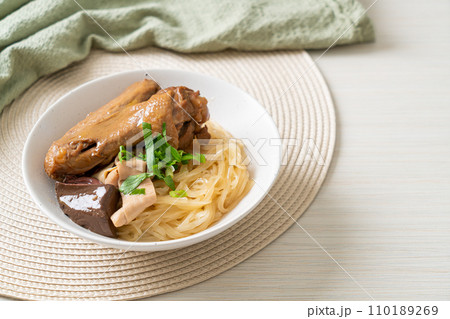 dried noodles with braised duck in white bowl dried noodles with braised duck in white bowl 110189269