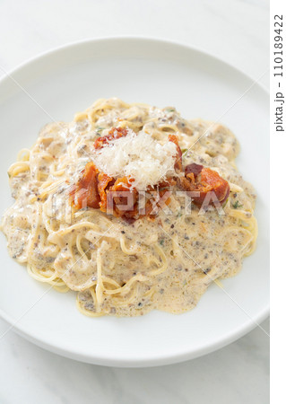 spaghetti with truffle cream sauce and mushroom spaghetti with truffle cream sauce and mushroom 110189422