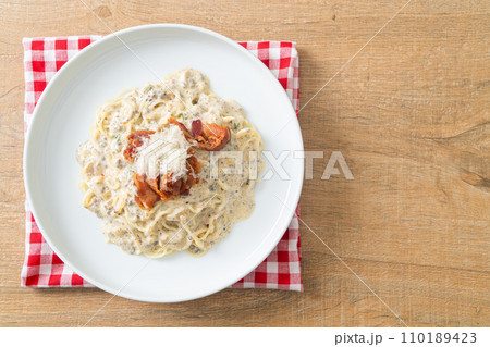 spaghetti with truffle cream sauce and mushroom spaghetti with truffle cream sauce and mushroom 110189423