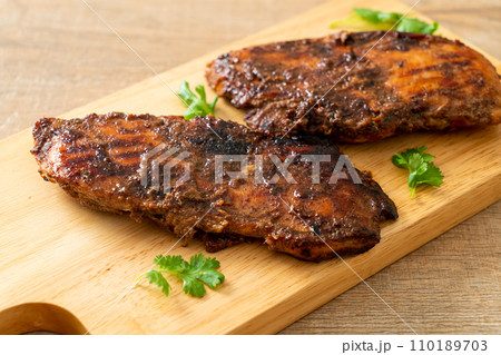spicy grilled jamaican jerk chicken 110189703