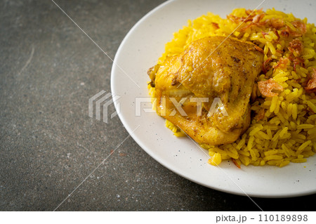 Chicken Biryani or Curried rice and chicken - Thai-Muslim version of Indian biryani, with fragrant yellow rice and chicken 110189898