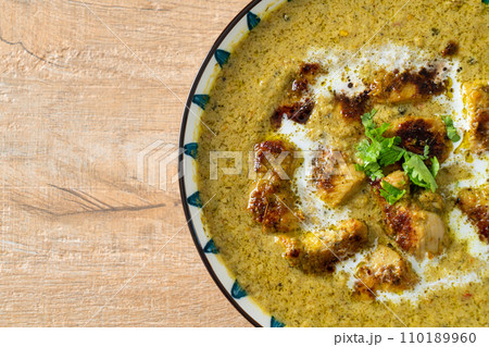 Afghani chicken in green curry or Hariyali tikka chicken hara masala 110189960