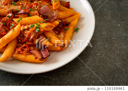 stir-fried penne pasta with kimchi and bacon 110189961