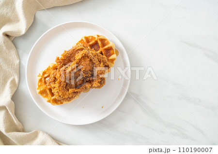 fried chicken waffle with honey or maple syrup fried chicken waffle with honey or maple syrup 110190007