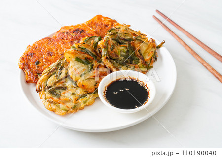 Pajeon or Korean pancake and Korean Kimchi pancake or Kimchijeon on white background 110190040