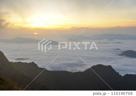 Top view Landscape of Morning Mist with Mountain Layer at north of Thailand. mountain ridge and clouds in rural jungle bush forest Top view Landscape of Morning Mist with Mountain Layer at north of Thailand. mountain ridge and clouds in rural jungle bush forest 110190708
