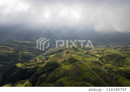 Top view Landscape of Morning Mist with Mountain Layer at north of Thailand. mountain ridge and clouds in rural jungle bush forest Top view Landscape of Morning Mist with Mountain Layer at north of Thailand. mountain ridge and clouds in rural jungle bush forest 110190797