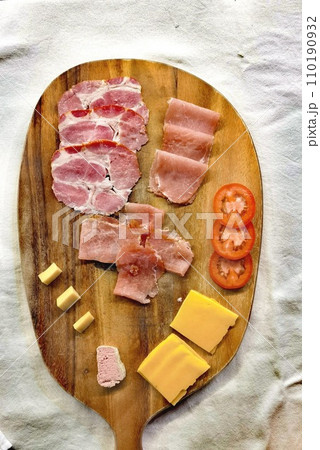 Slices of different cold cuts and cheeses  110190932