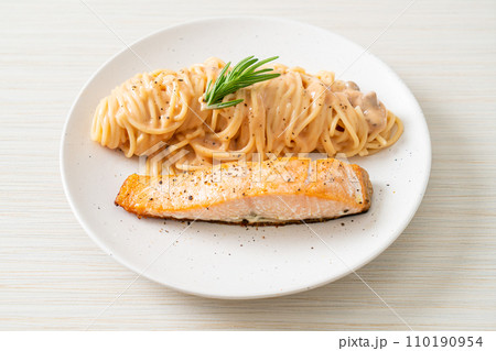 grilled salmon with spaghetti creamy tomato sauce grilled salmon with spaghetti creamy tomato sauce 110190954