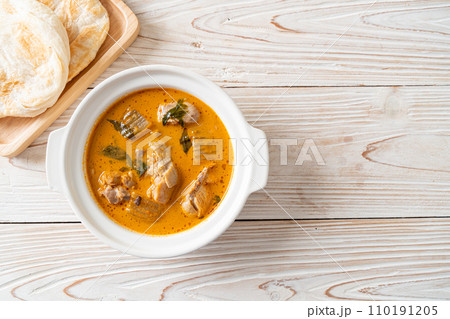 Chicken curry soup with roti 110191205