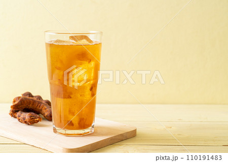 Delicious sweet drink tamarind juice and ice cube Delicious sweet drink tamarind juice and ice cube 110191483