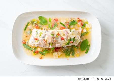 steamed sea bass fish with herbs 110191834