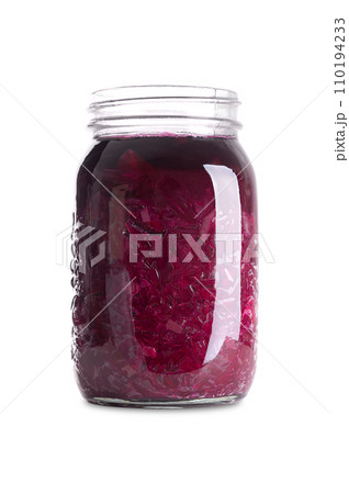 Red cabbage, homemade fermented German Blaukraut in a glass jar. Cut raw red cabbage, fermented by lactic acid bacteria. Unpasteurized and uncooked blaukraut provides probiotics and improve digestion. 110194233