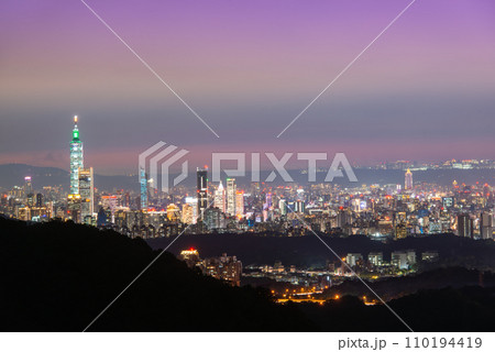 Stunning city skyline from dusk to illuminated. Taipei, Taiwan. Stunning city skyline from dusk to illuminated. Taipei, Taiwan. 110194419