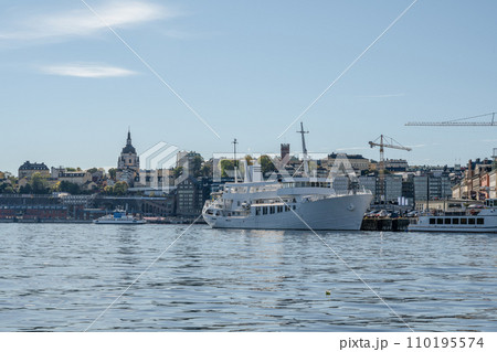 Scenic summer panorama of the Old Town Gamla Stan pier architecture in Stockholm, Sweden Scenic summer panorama of the Old Town Gamla Stan pier architecture in Stockholm, Sweden 110195574