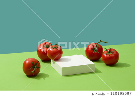 Blank podium in square shaped displayed with several tomatoes. Product presentation, mockup, show cosmetic product, Podium, stage pedestal or platform 110198697