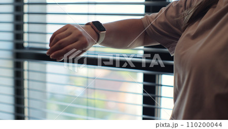 Woman fingers does double tap on smart watch for hands-free interaction. Girl making gestures on a smartwatch. Woman fingers does double tap on smart watch for hands-free interaction. Girl making gestures on a smartwatch. 110200044
