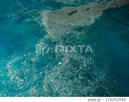 Indian ocean and plastic trash, drone view. Pollution by plastic rubbish in Bali 110202098