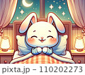 白うさぎがパジャマを着てベッドに入って笑っている 110202273