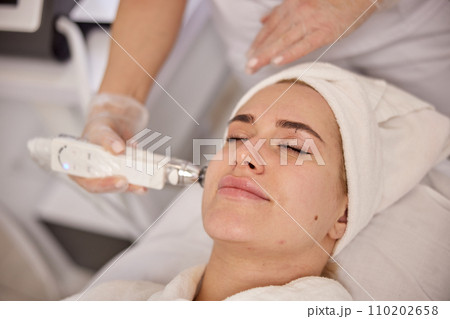 Aesthetic treatment, Body therapy, Slimming procedures. Therapists use specialized vacuum equipment to focus on slimming specific body areas. 110202658