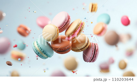 Various colorful macarons float in the air on the isolated background 110203644