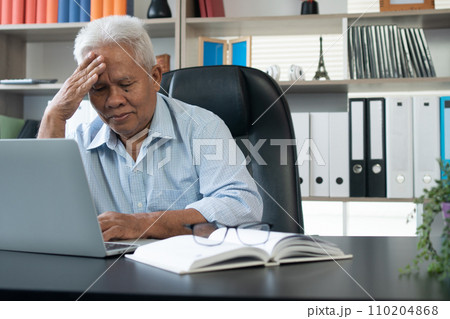 Happy senior Asian using the laptop for calculating and make a note of daily expenses. Concept of lifestyle, learning, and finance business 110204868