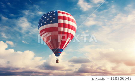A hot air balloon, an airship flies in the clouds of the sky in the color of the flag of the United States of America. 110206045