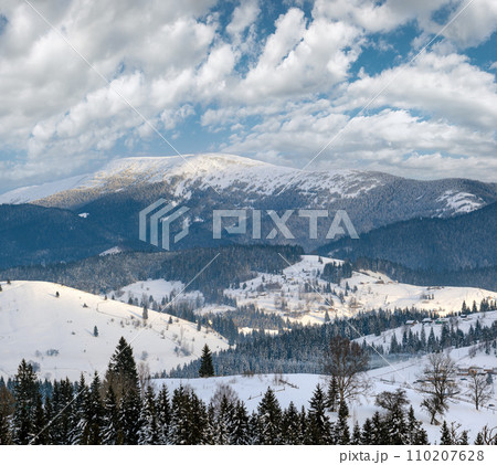 Small alpine village and winter snowy mountains, Voronenko, Carpathian, Ukraine. 110207628