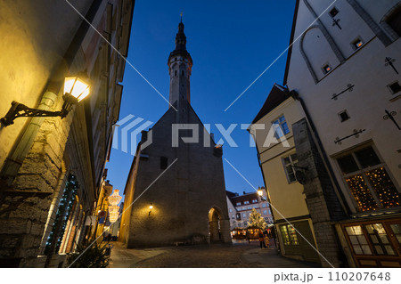 View of the Town hall in the old town of Tallinn in the evening in winter. Tallinn city, Estonia. 110207648