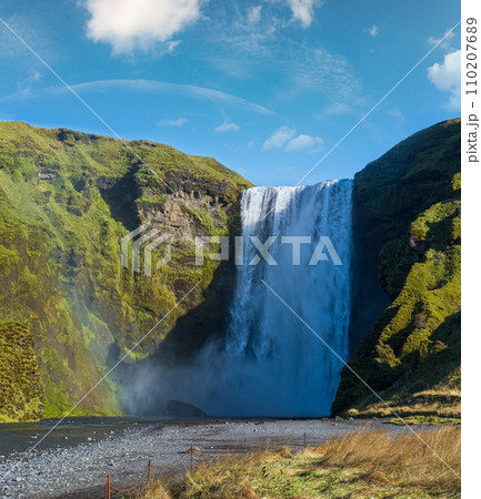 Picturesque full of water big waterfall Skogafoss autumn view, southwest Iceland. Picturesque full of water big waterfall Skogafoss autumn view, southwest Iceland. 110207689